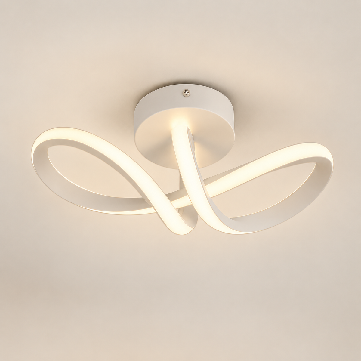 Arca curved ribbon LED ceiling light, lit, on a greige studio background