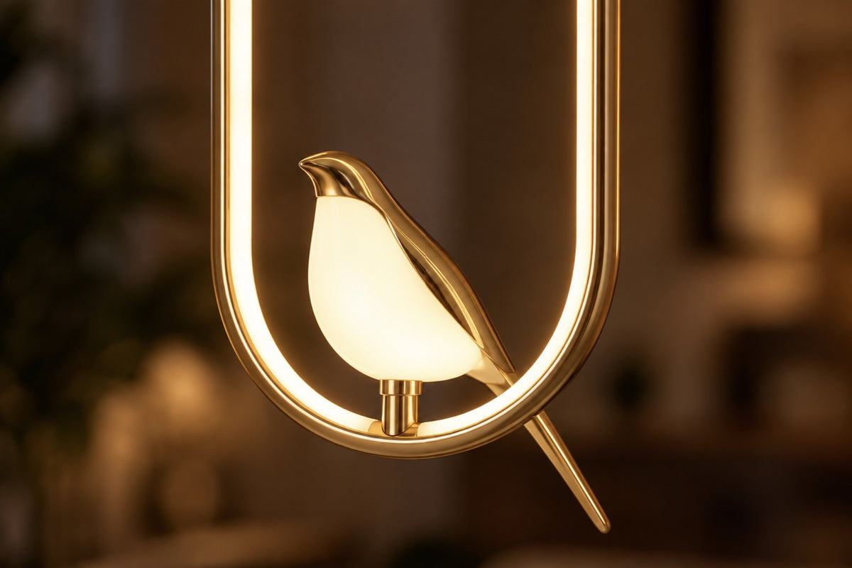 Close-up of the Aviora glowing acrylic bird inside its gold LED frame