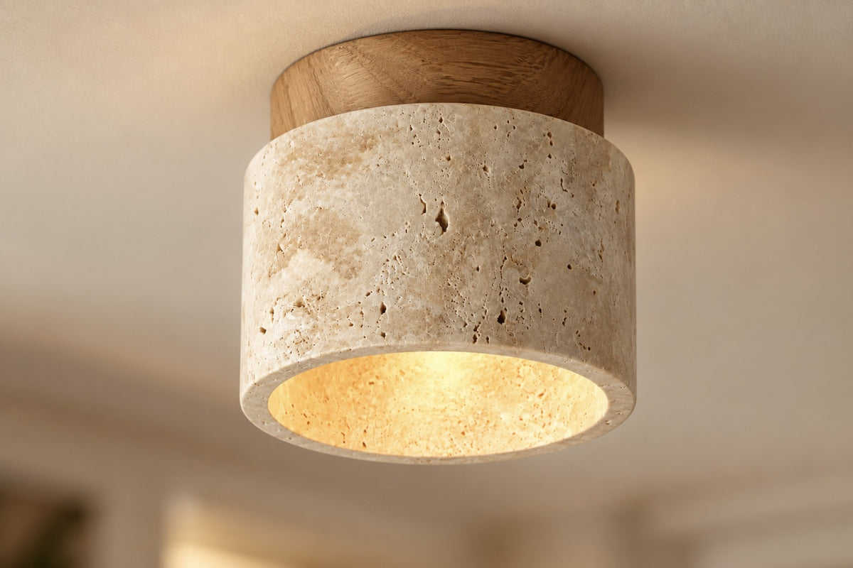 Close-up of the Calvera travertine drum and oak cap, lit, on the ceiling
