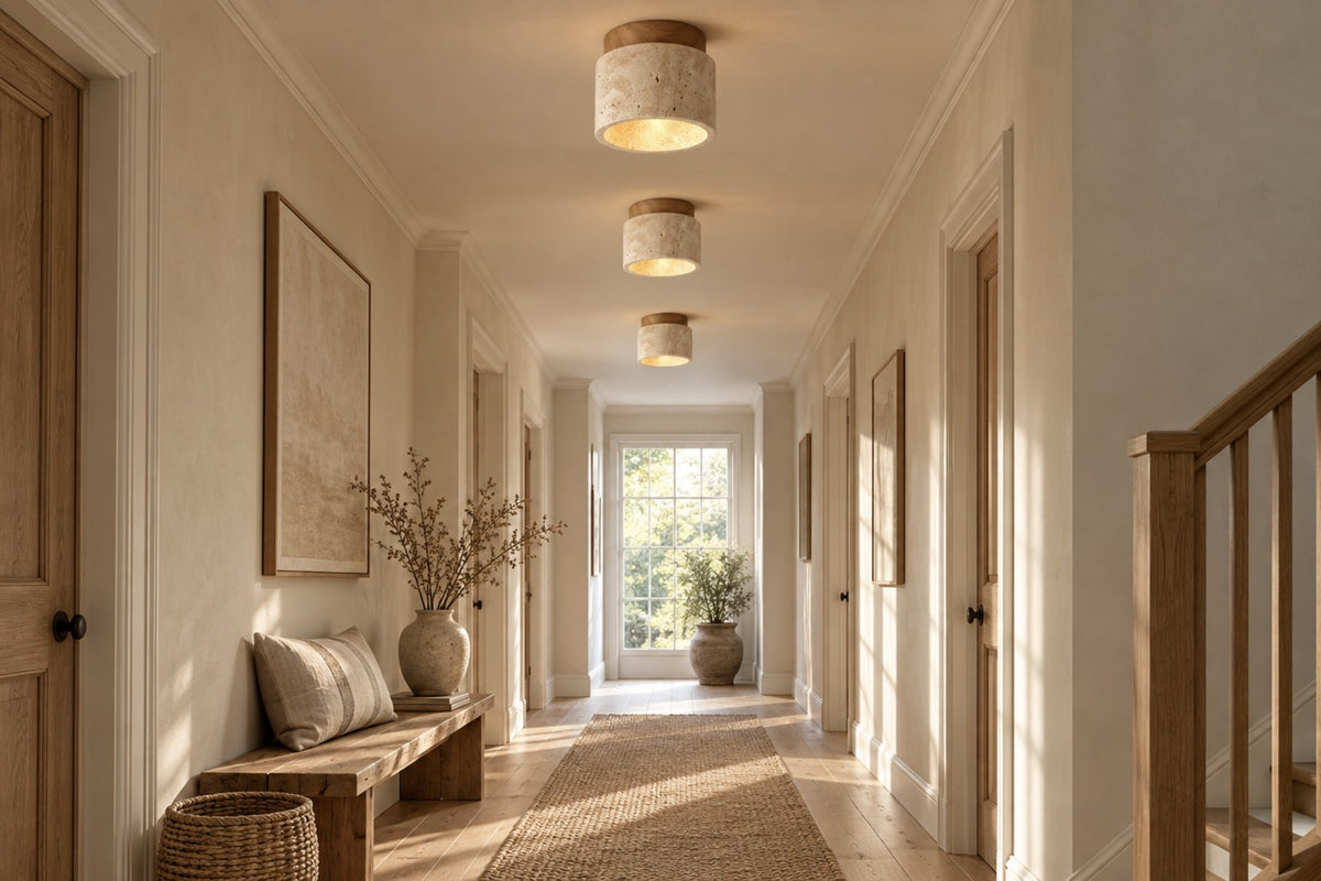 Three Calvera travertine ceiling lights along a bright hallway