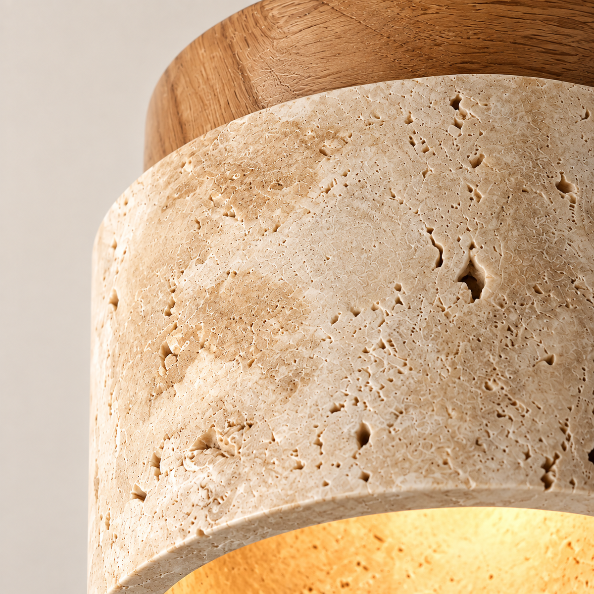 Close-up of the Calvera travertine pores and light wooden cap