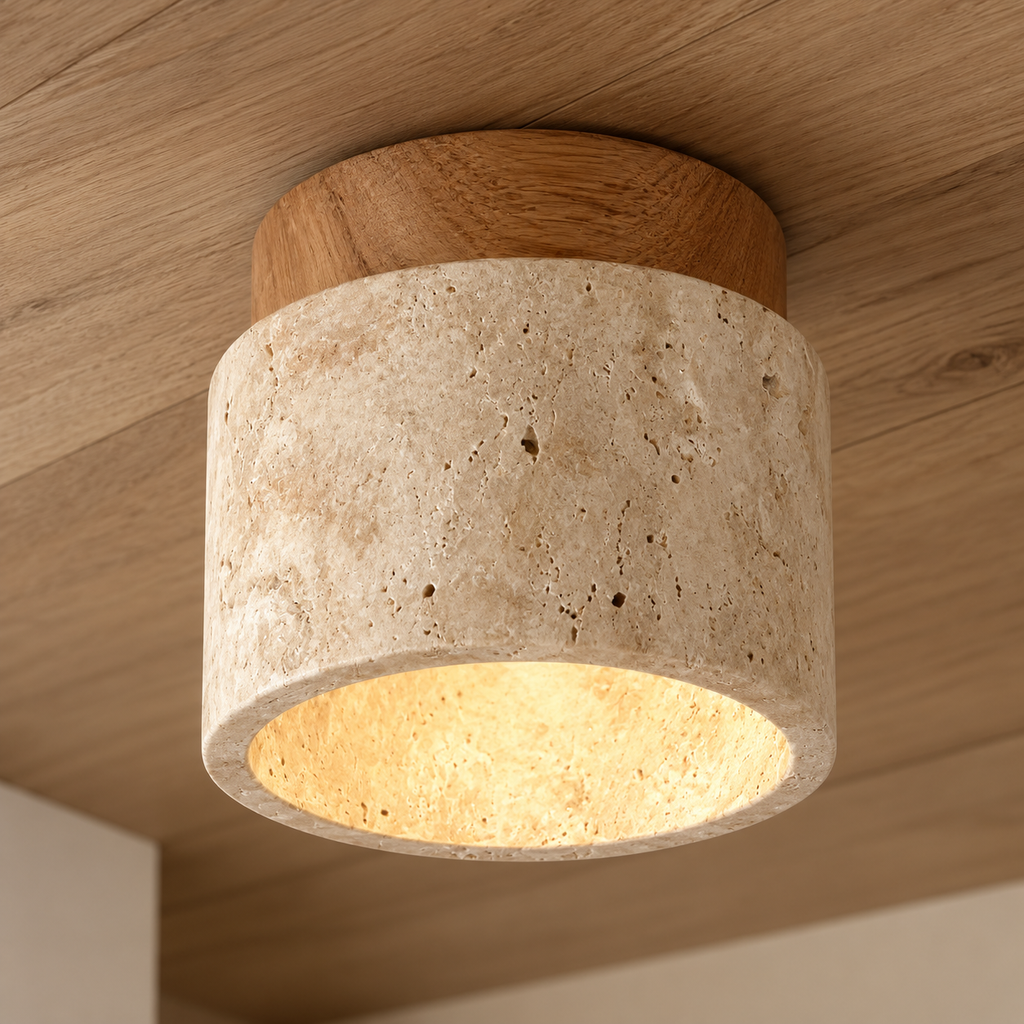 Close-up of the Calvera travertine shade and light wood cap
