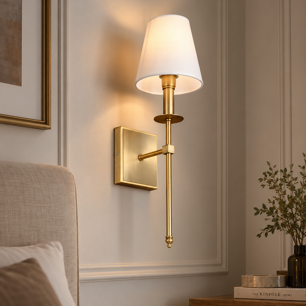 Clara gold wall light with white fabric shade in a living room