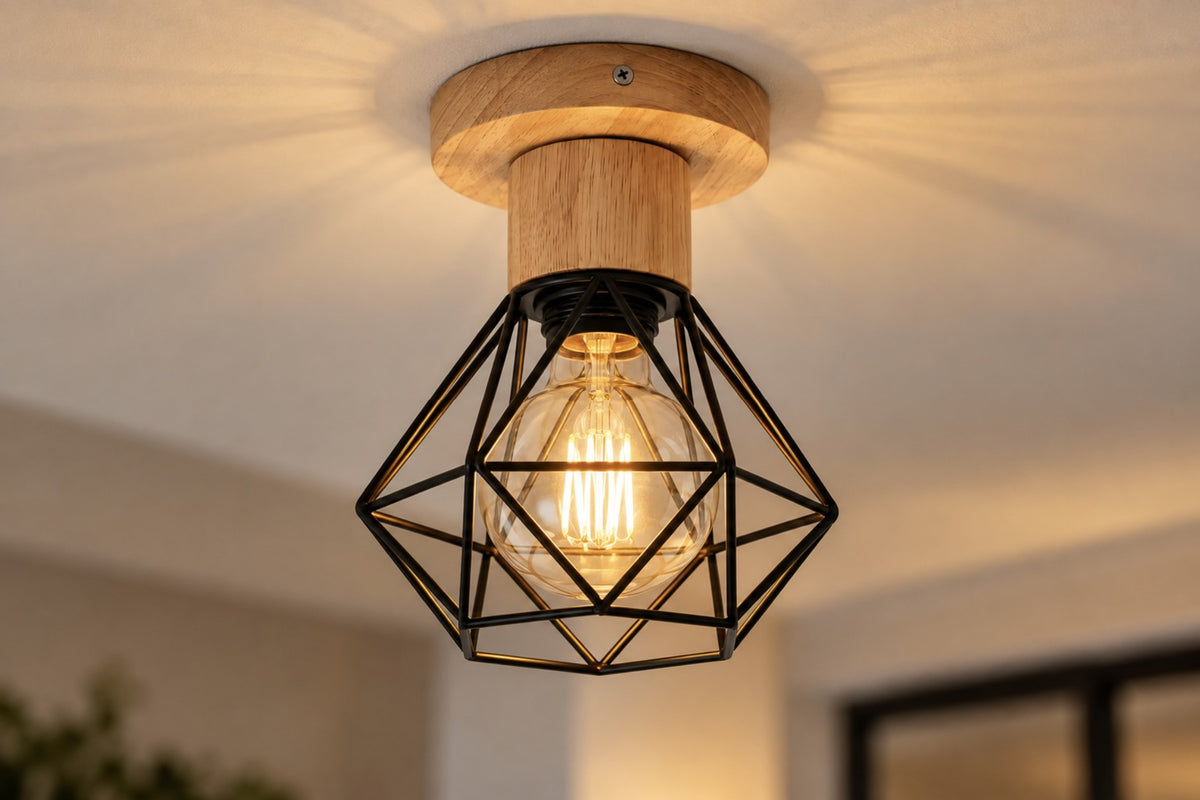 Close-up of the Ferro wood base and black geometric cage with a glowing filament bulb