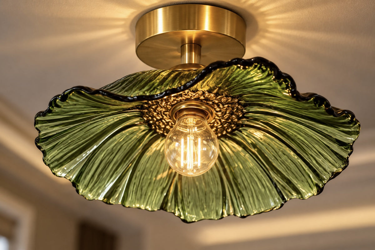 Close-up of the Florea ruffled green glass petal shade and brushed-brass holder