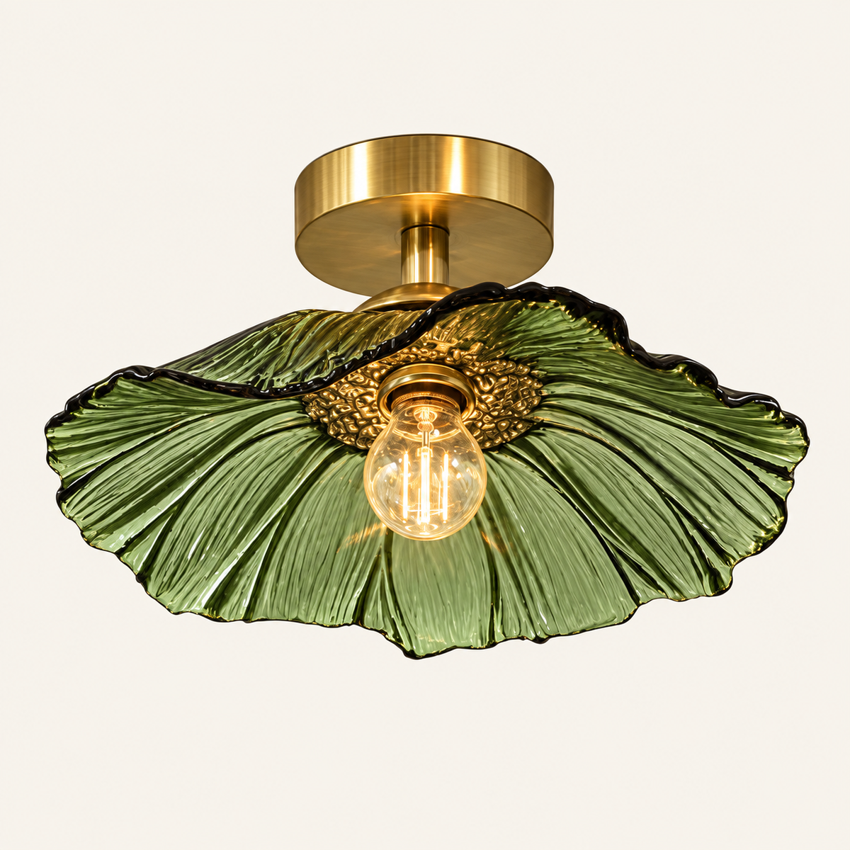 Florea glass petal ceiling light in green glass with a brass canopy