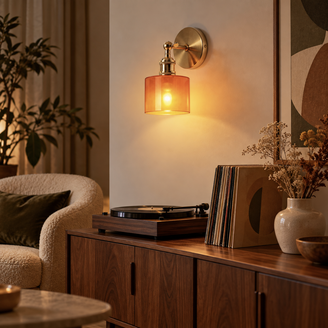 Ines rechargeable amber glass wall light above a record player in a mid-century living room