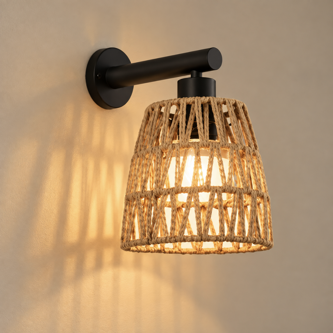 Kasia cordless rechargeable woven wall light, lit, on a greige wall