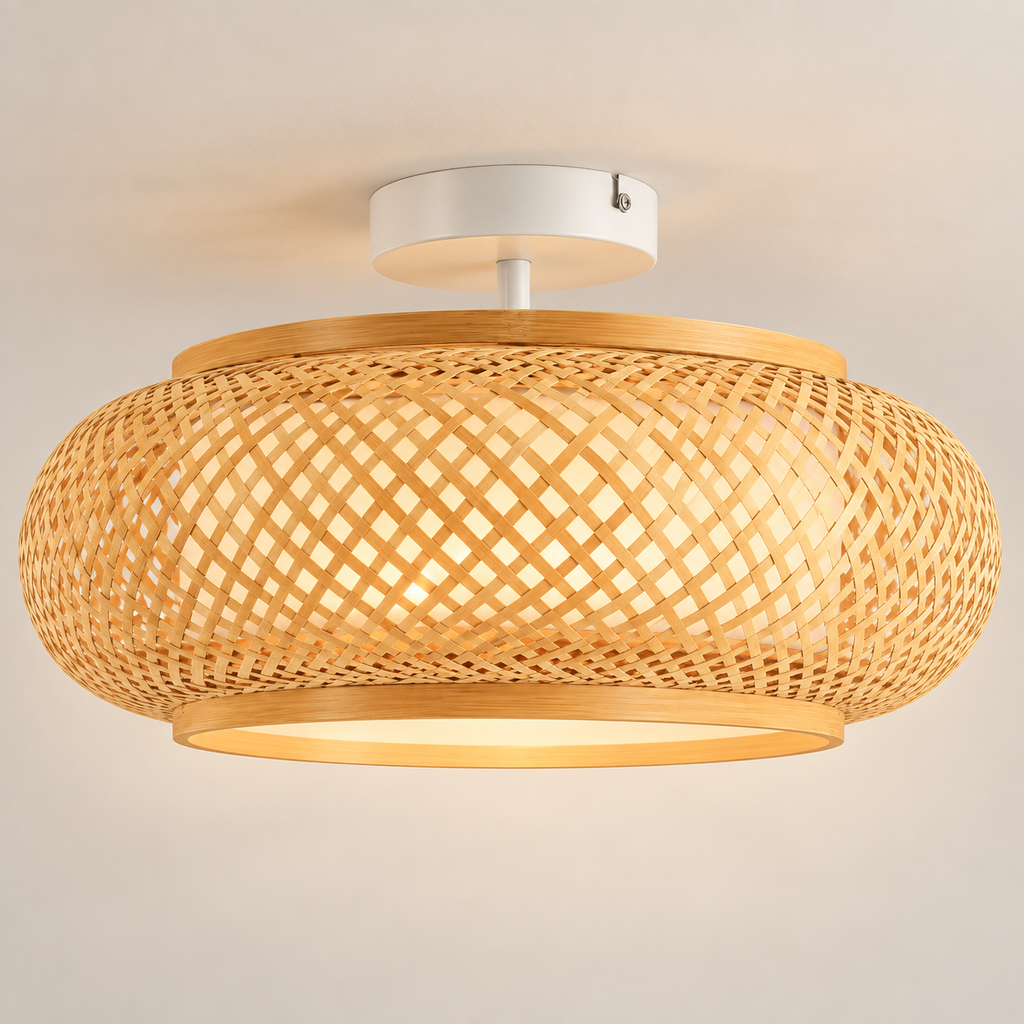 Kora hand-woven bamboo drum ceiling light, lit, on a greige studio background