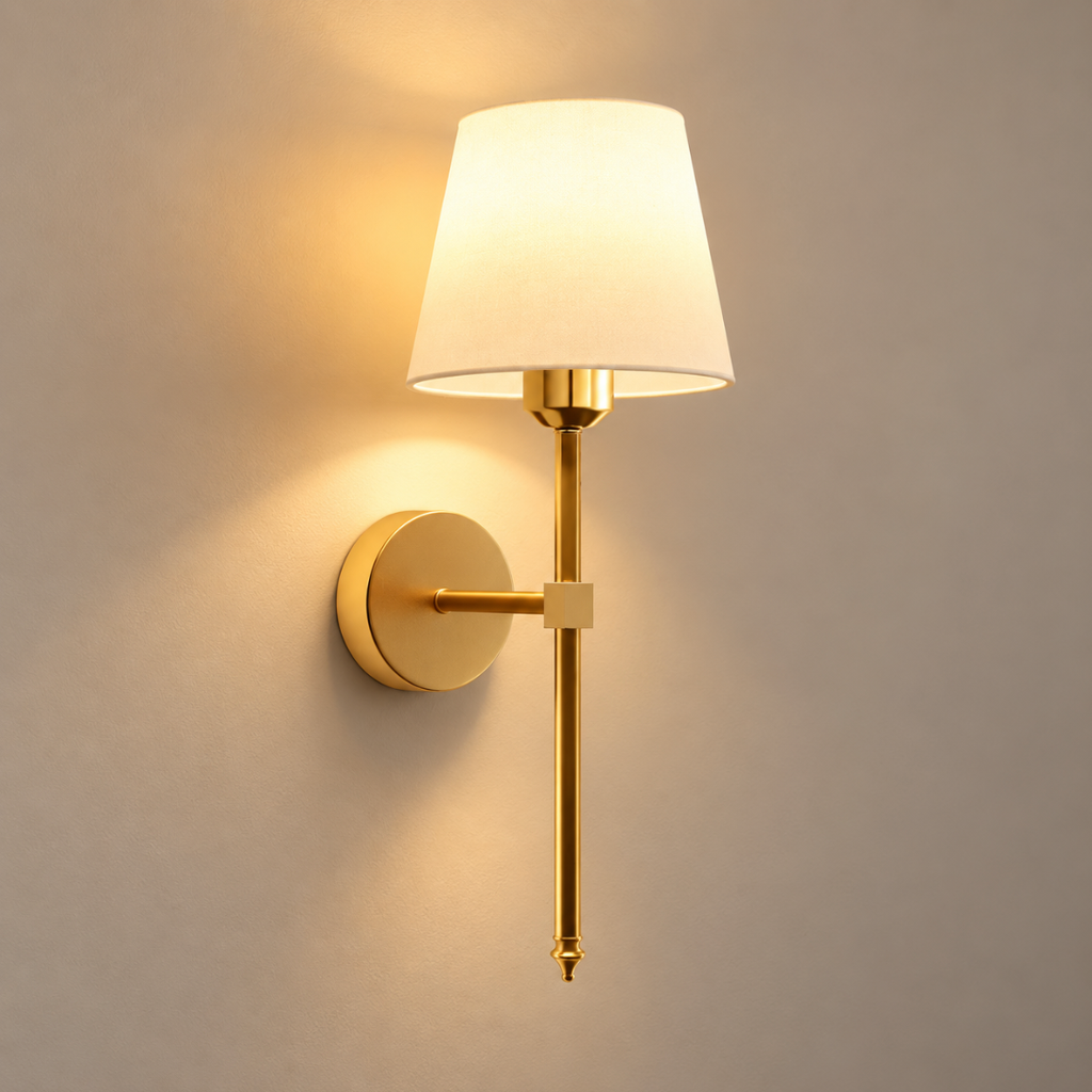 Maren cordless rechargeable wall light in gold, lit, on a greige wall