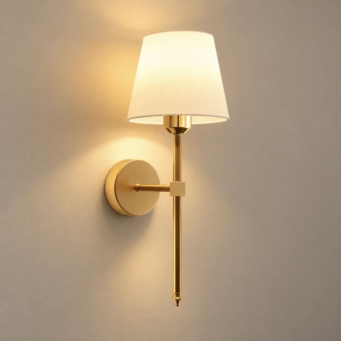 Maren cordless rechargeable wall light in gold, lit, on a greige wall