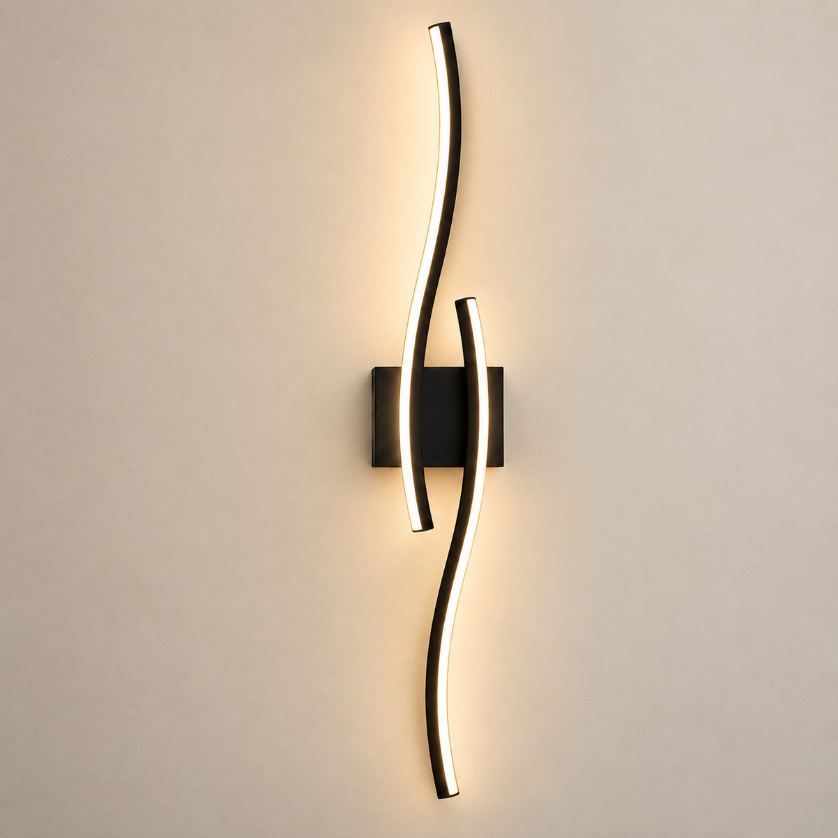 Onda black wave LED wall light, lit, on a greige wall
