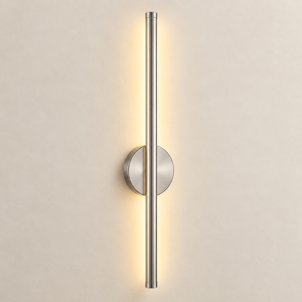 Orla cordless rechargeable wall light in brushed silver, lit, on a greige wall