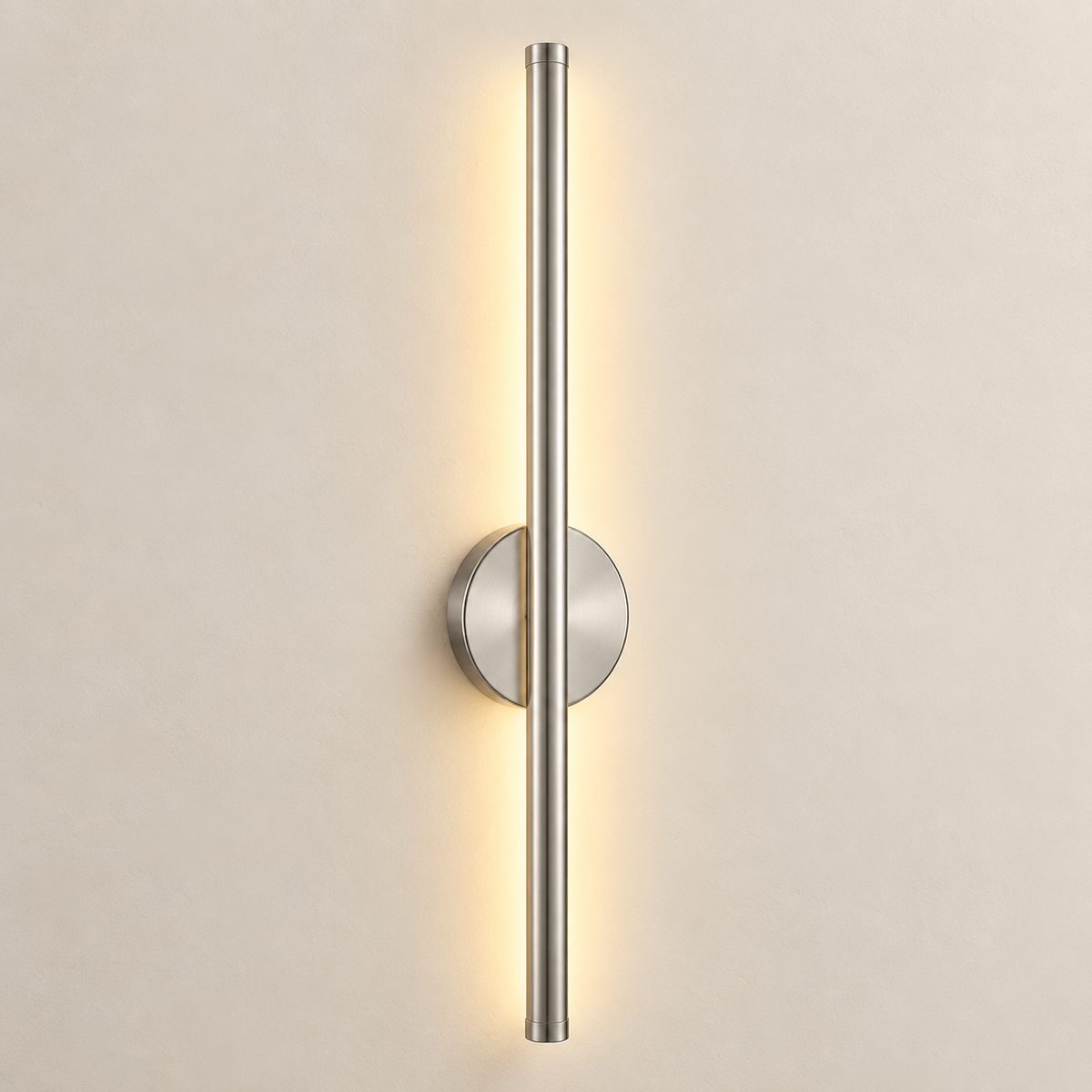 Orla cordless rechargeable wall light in brushed silver, lit, on a greige wall