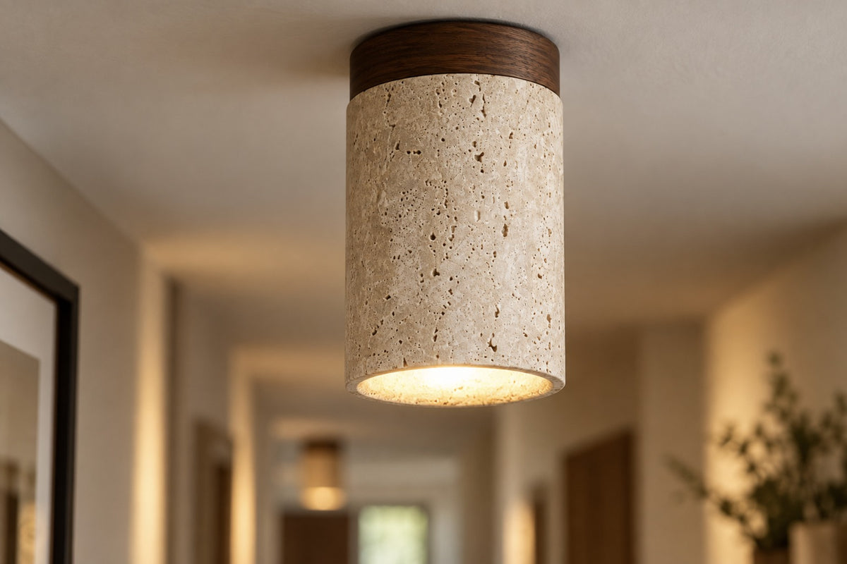 Close-up of the Siena travertine cylinder and walnut rim, lit