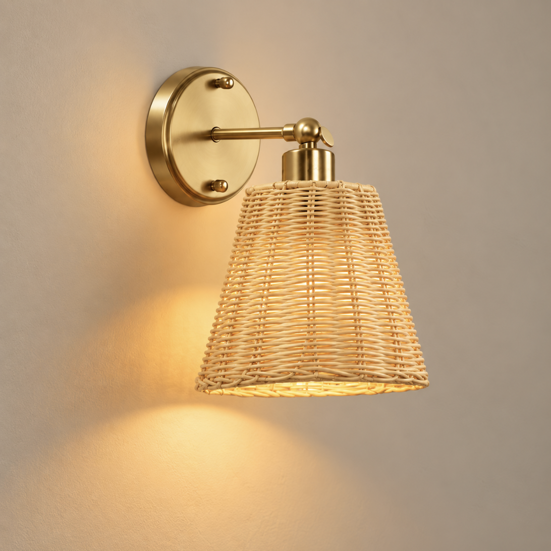 Solenne cordless rechargeable rattan wall light, lit, on a greige wall