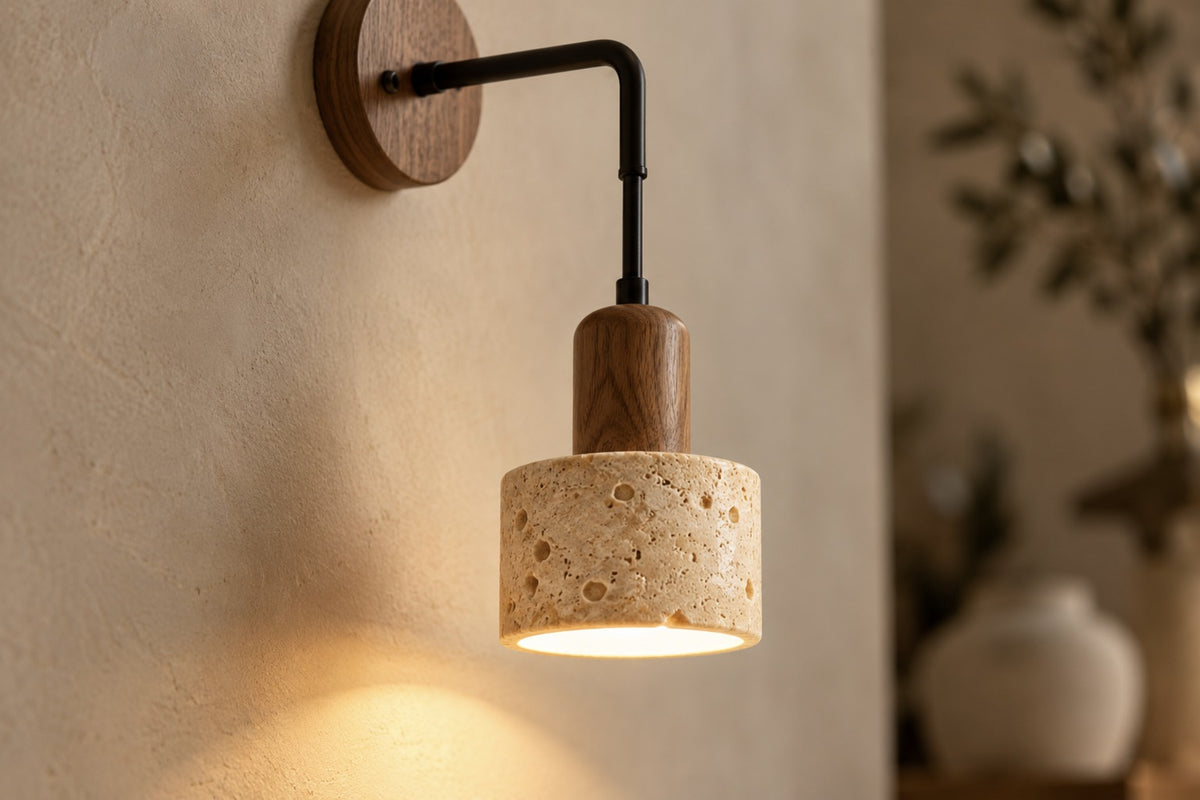 Close-up of the Sora travertine shade and walnut holder, lit