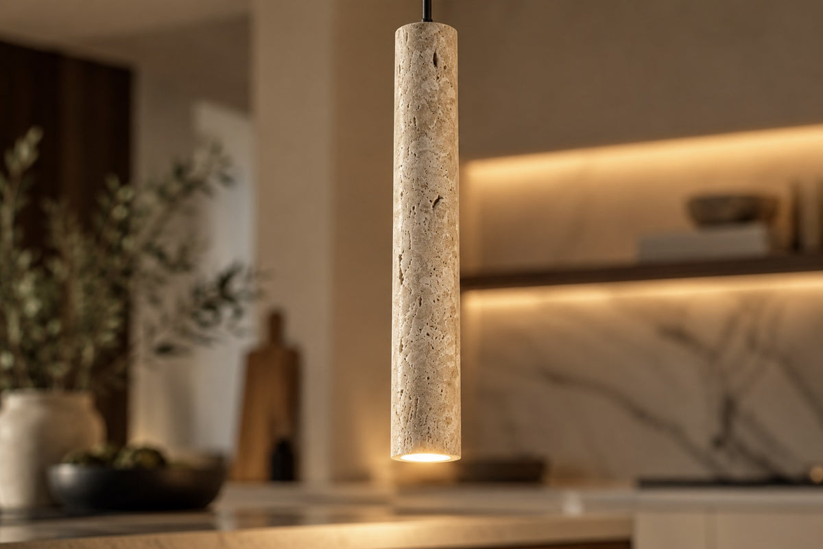 Close-up of the Sorelia stone tube pendant and its porous texture, lit