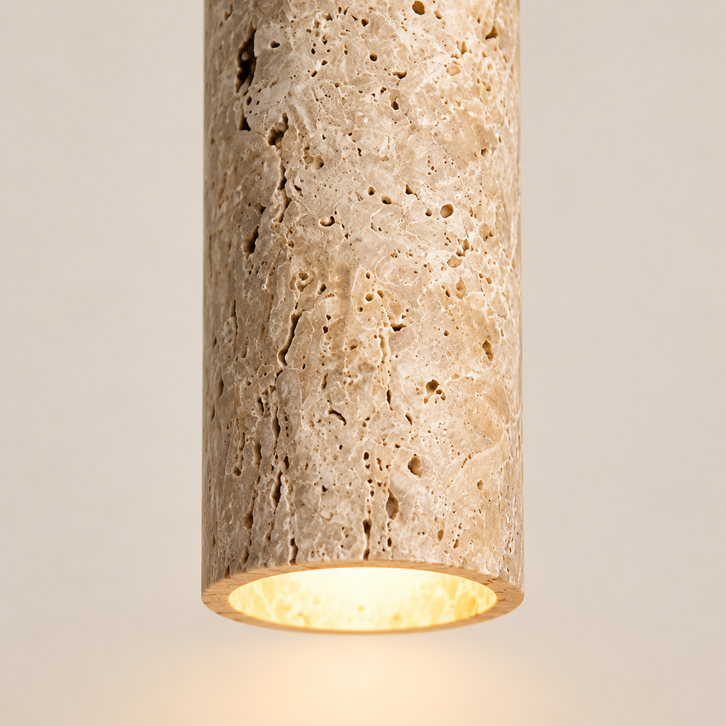 Close-up of the Sorelia porous stone texture and warm downlight