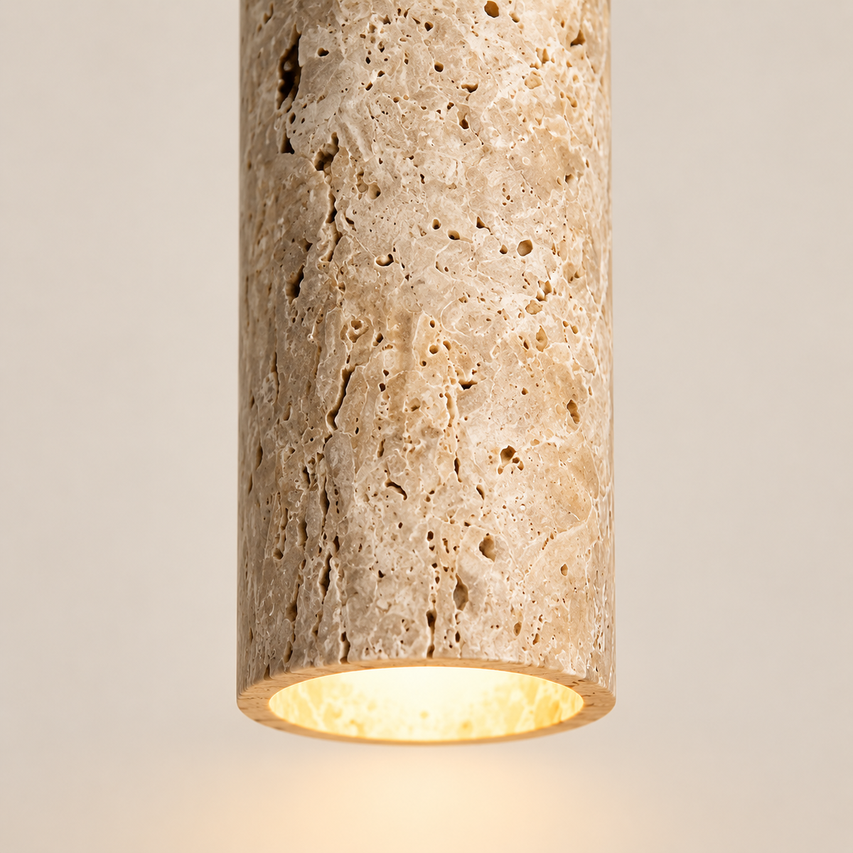 Close-up of the Sorelia porous stone texture and warm downlight