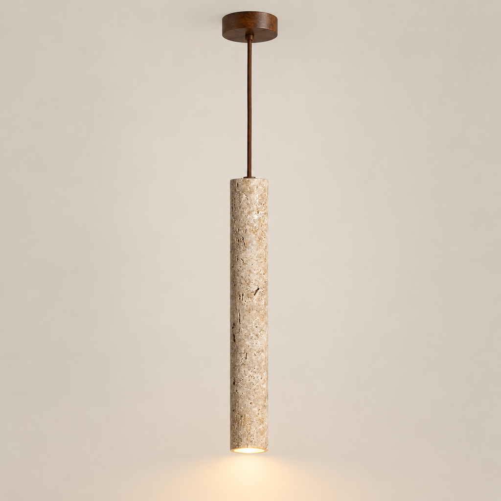 Sorelia travertine-look stone tube LED pendant light, lit, on a greige studio background