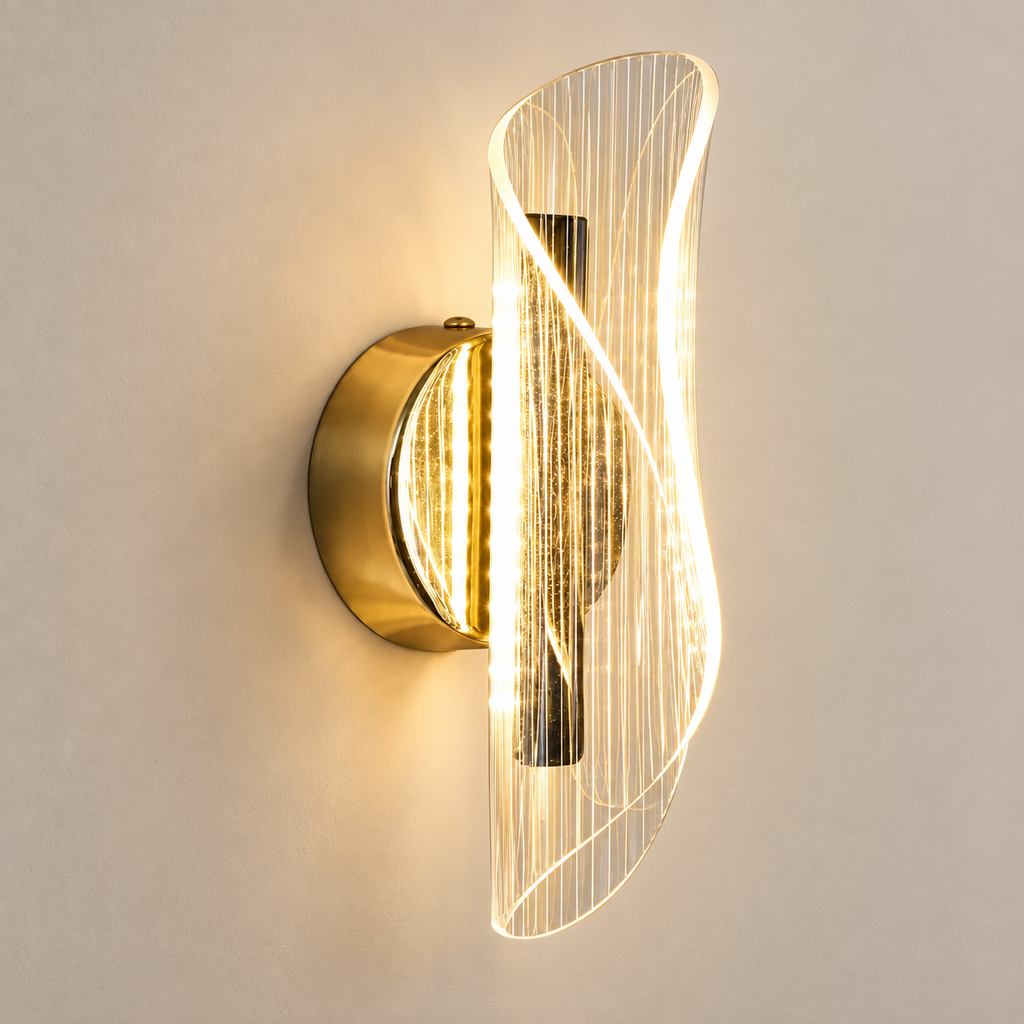 Velia gold and ribbed acrylic LED wall light, lit, on a greige wall