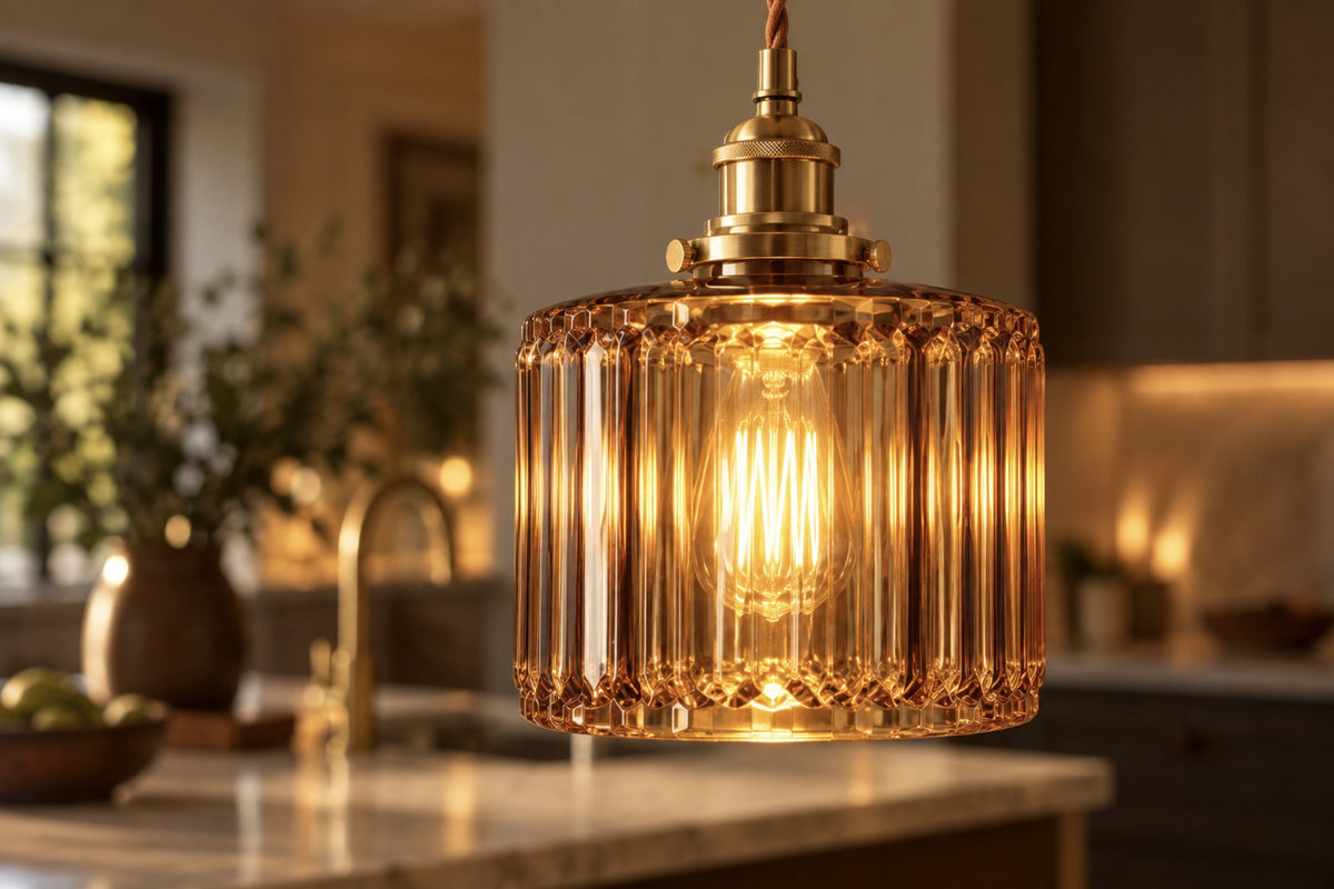 Close-up of the amber Verra ribbed glass shade and brass holder, lit