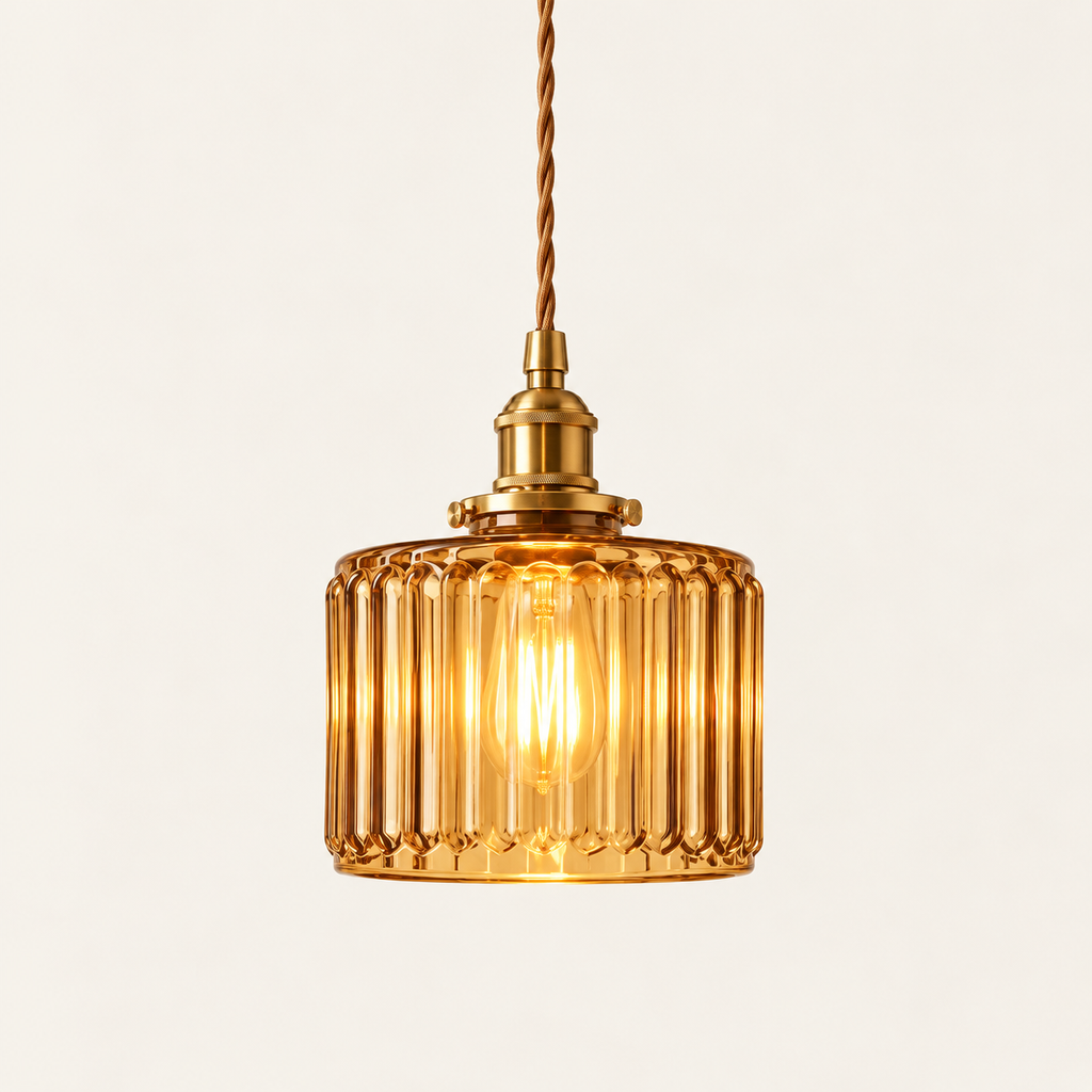Verra ribbed glass pendant light in amber glass with a brass holder
